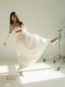 Brautrock Le Mans in Bewegung – elegantes Mikado-Design